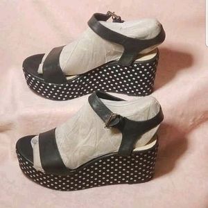Restricted black leather and white polka dotted cloth wedge platform sandal